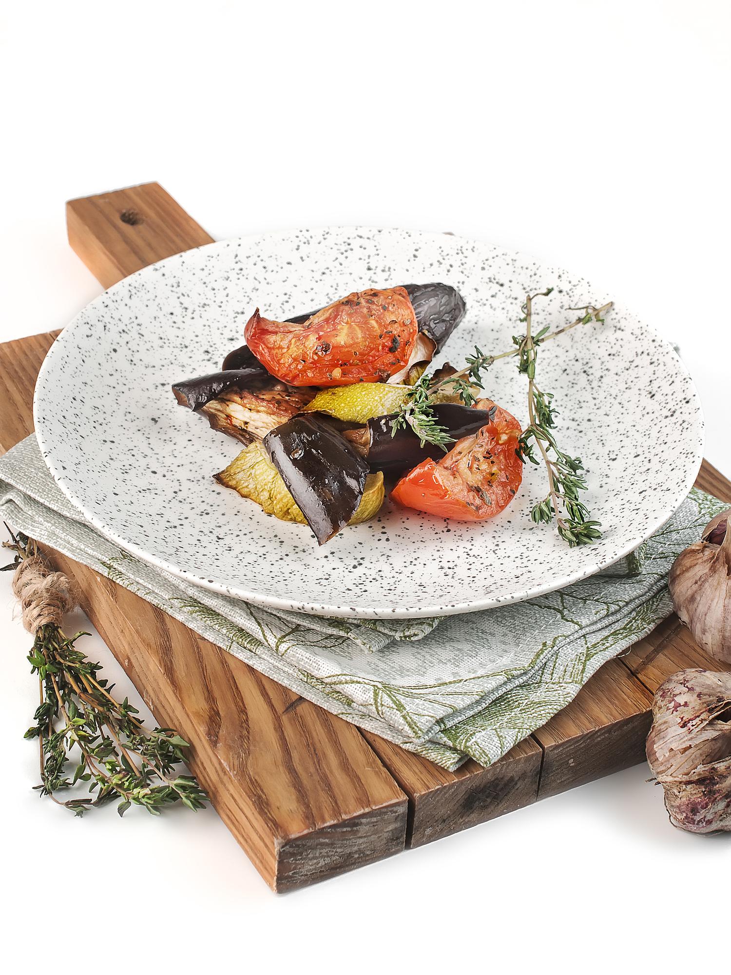 Set of artisanal cookware and plated meals